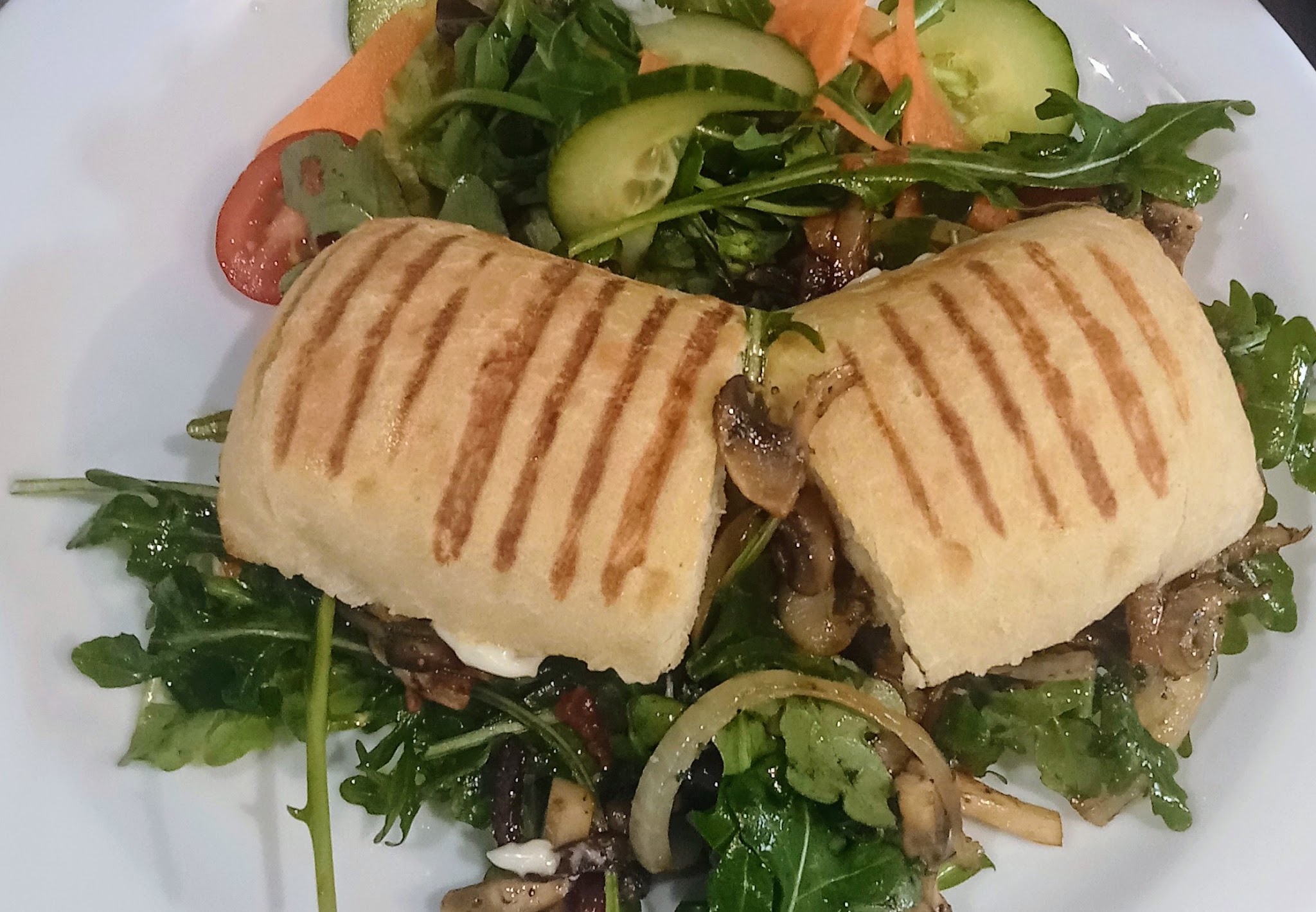 A toasted dish with a colourful side salad